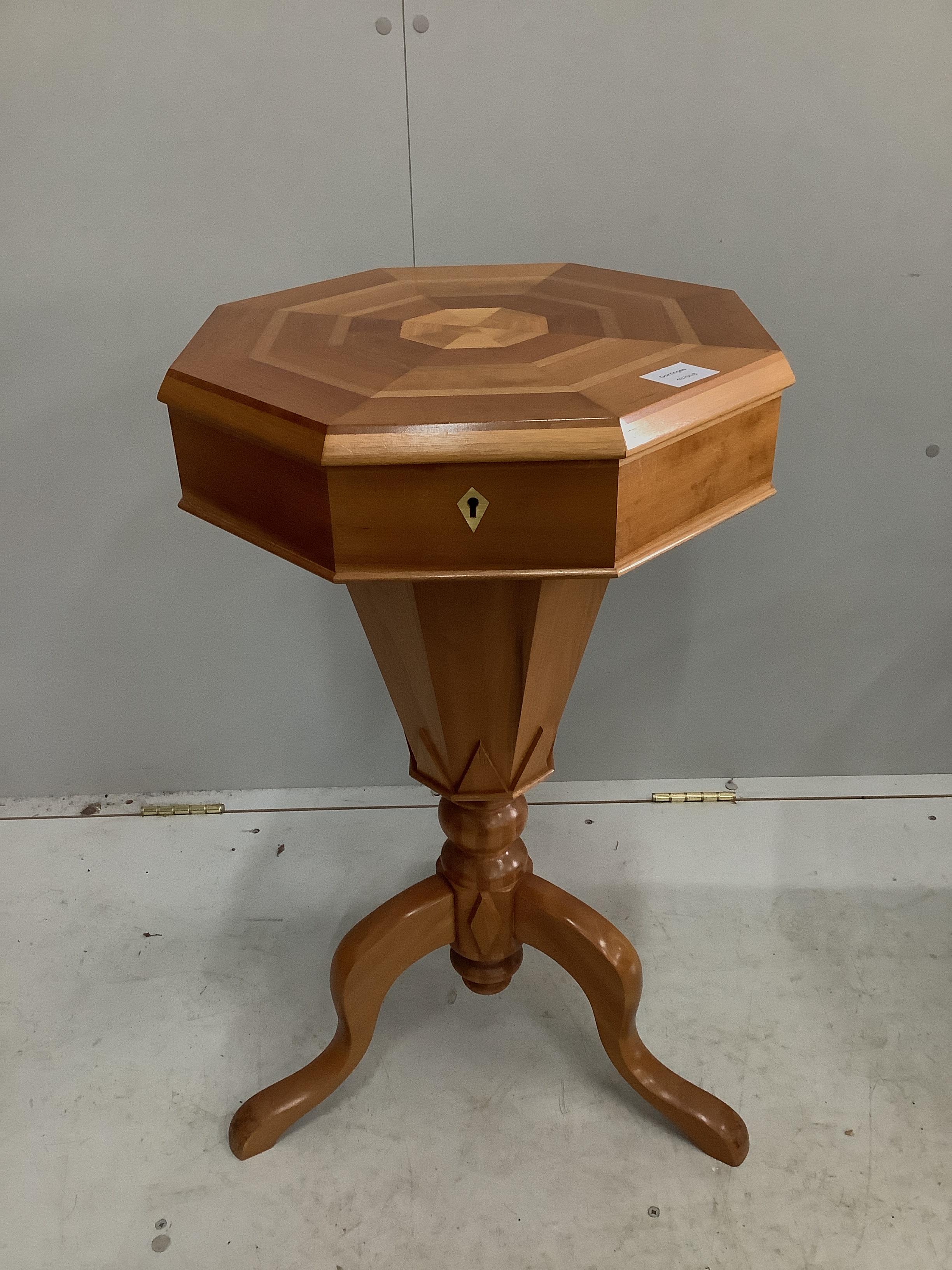 A reproduction Victorian style octagonal trumpet work table, width 42cm, height 74cm
